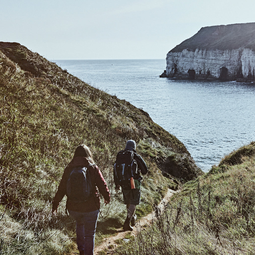 Man trail running on cliffs
