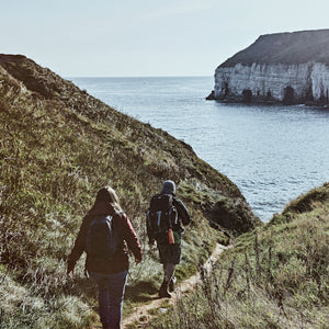 Man trail running on cliffs